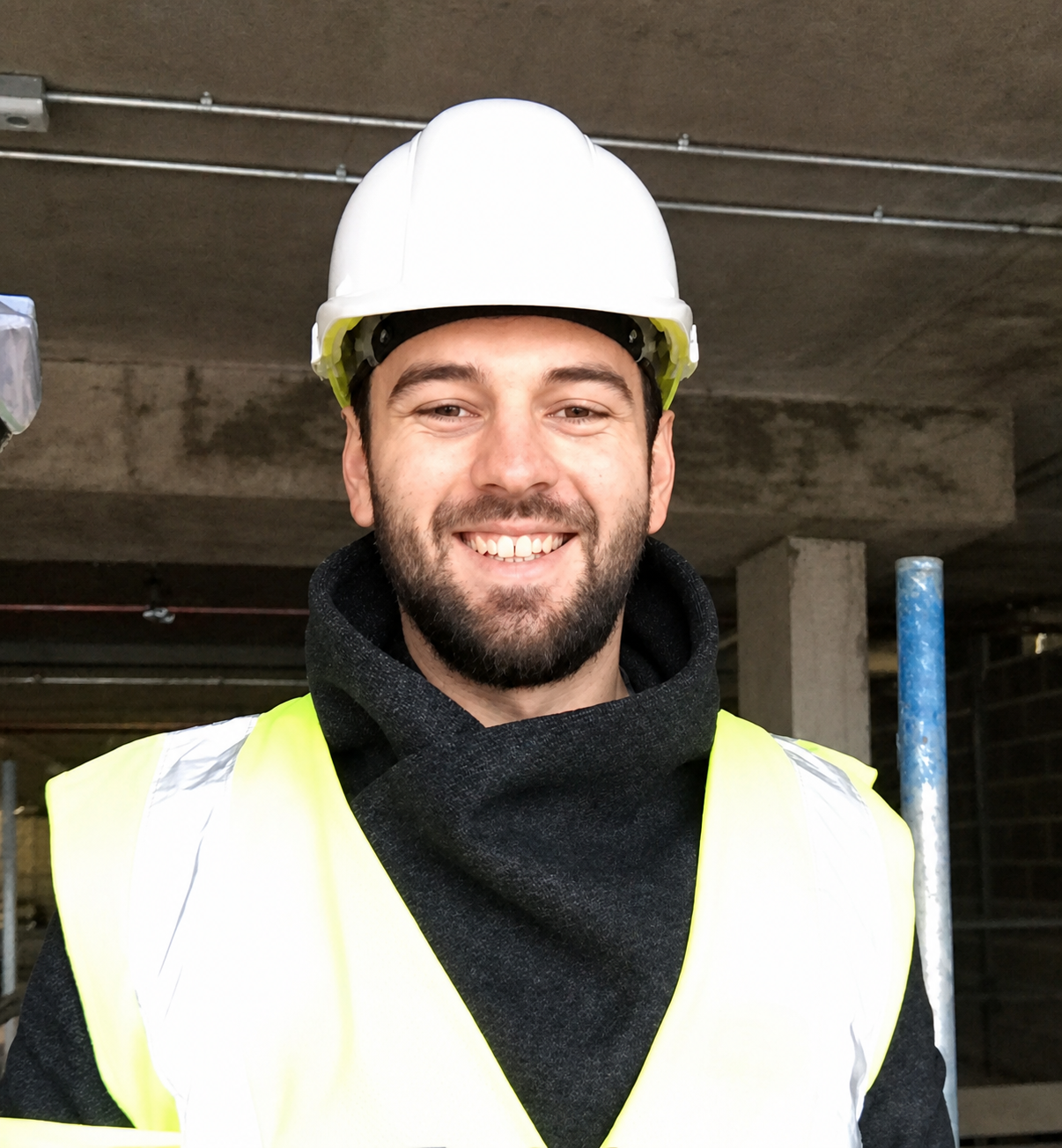Arbes Istrefi, Founder of SebraFix, on site in safety equipment